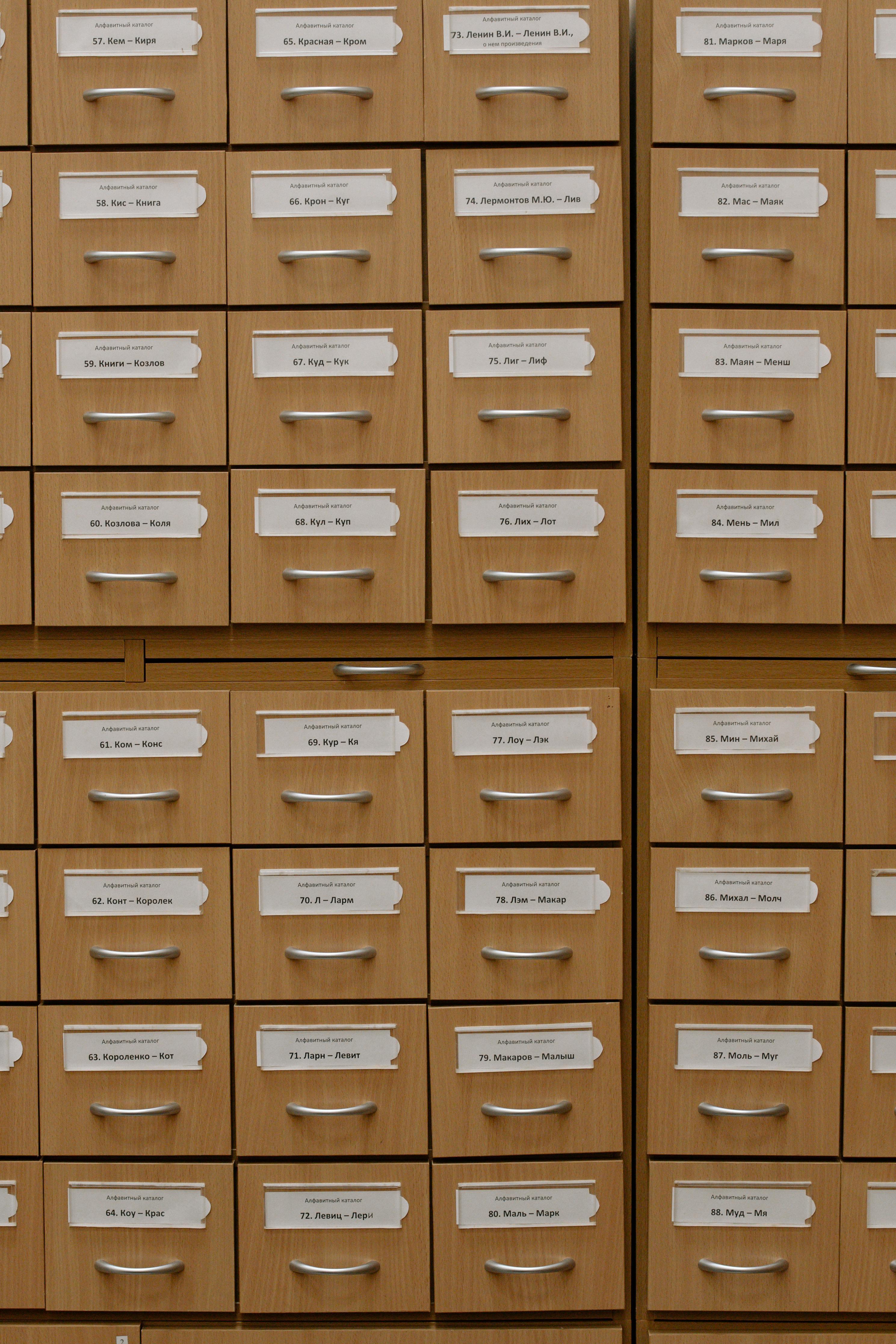 Many filing cabinet drawers organized in a grid