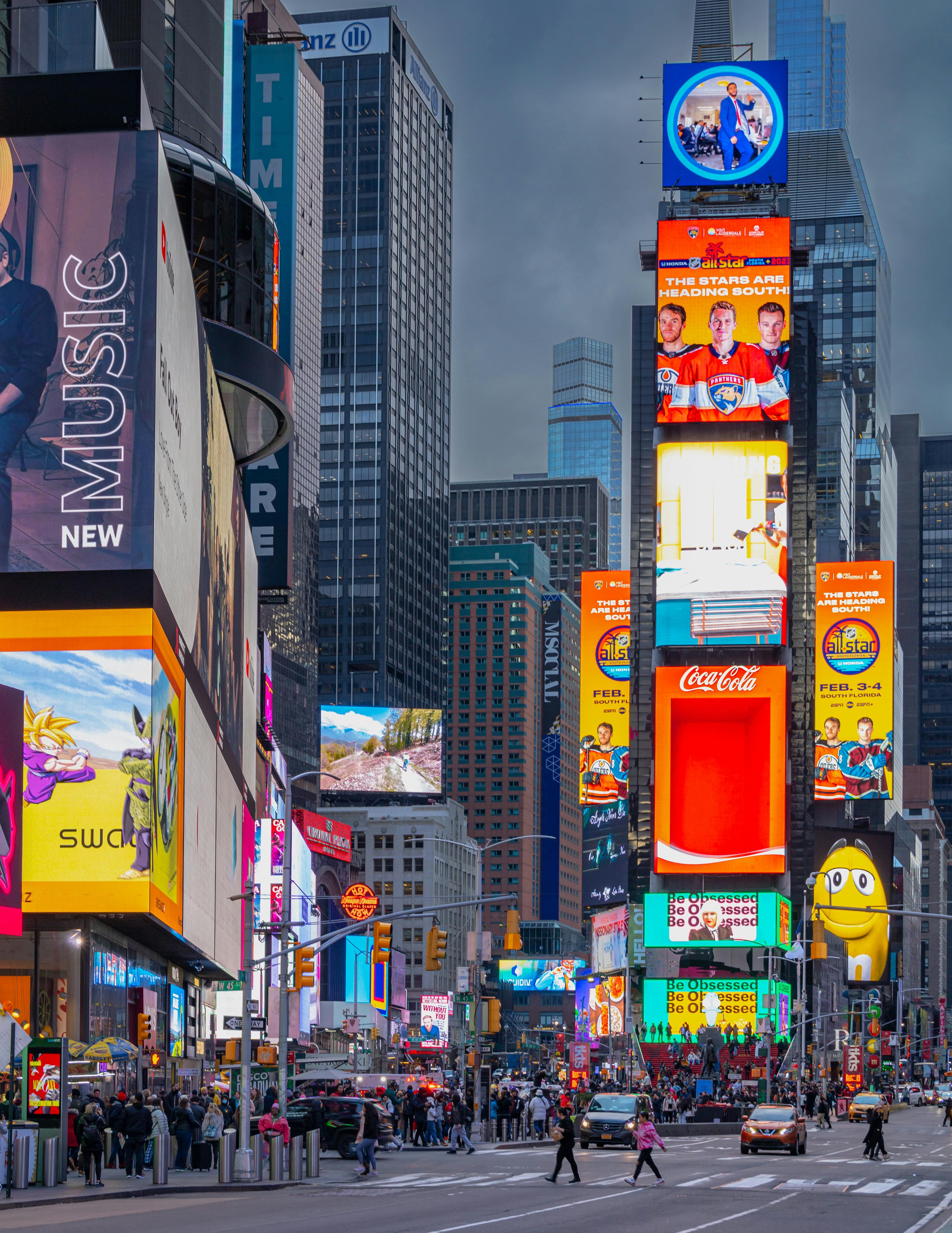 City square with large television jumbotrons on buildings