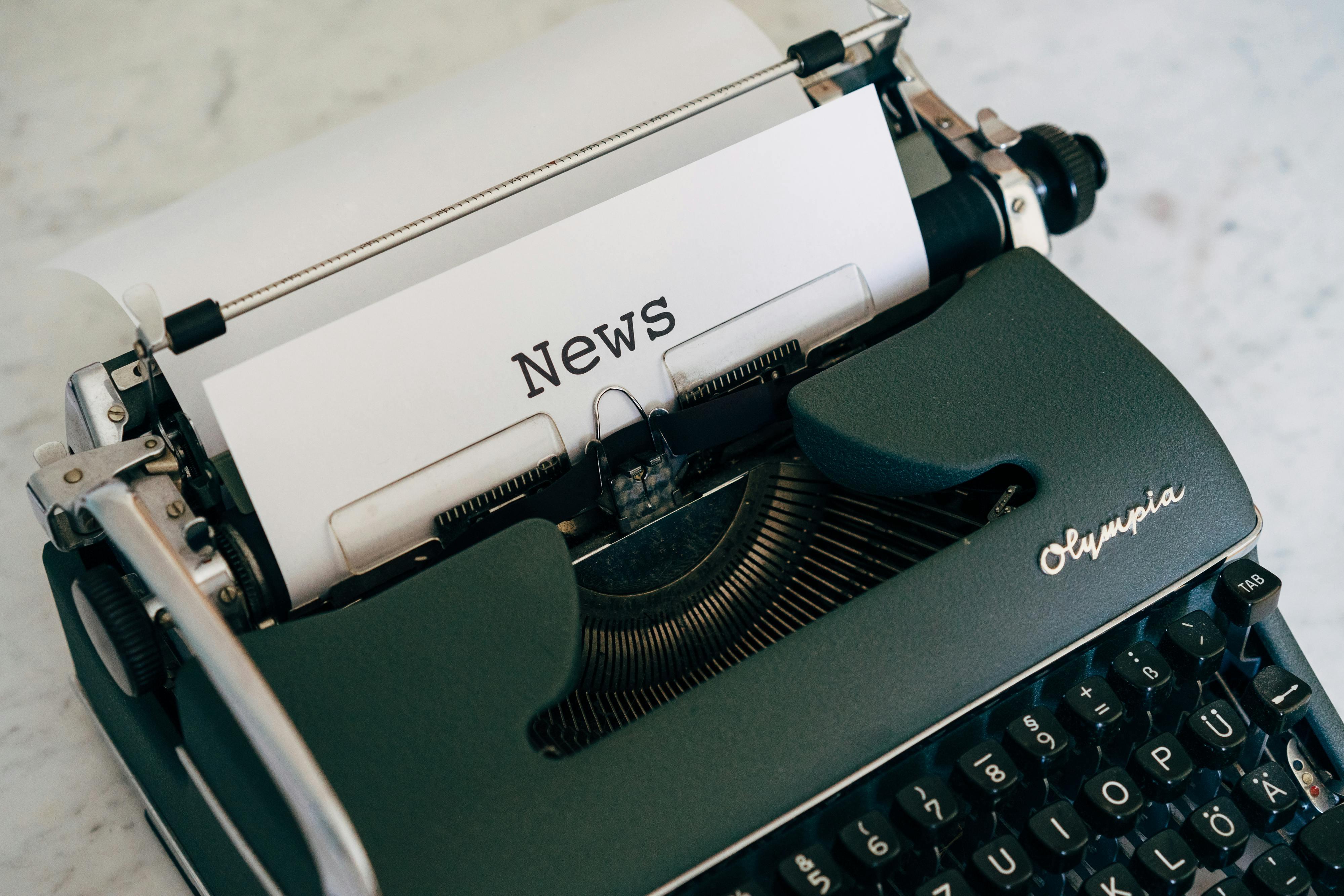 Typewrite printing a newspaper